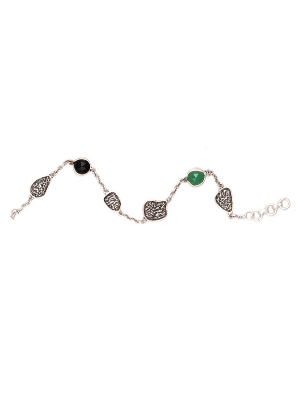 THIS LUSTROUS GREEN & BLACK STUDDED STONE WITH TEXTURE IS SIMPLY RADIATES JOY IN HAND