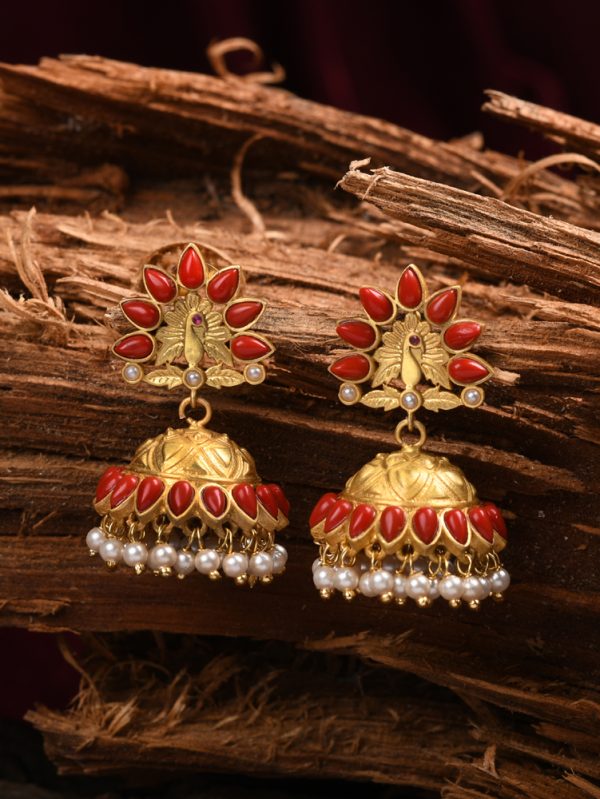 Escalate your ethnic look with these trendy moonga stone is styled up with feather of peacock and jhumka.