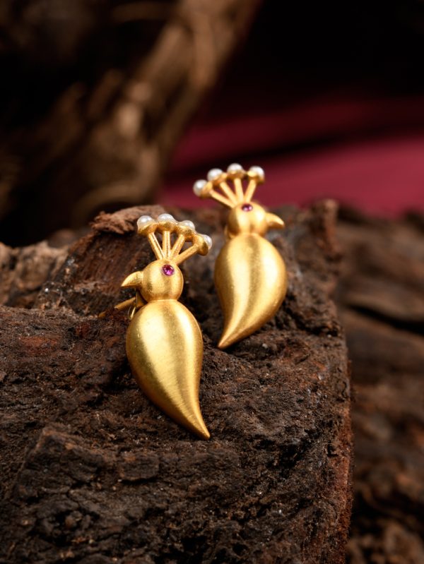 Promotes bye less, choose well ,with our Gold plated peacock stud earring .
