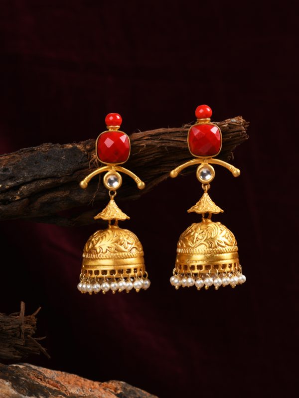 Crafted with gold textured with traditional jhumka & synthetic moonga stone.
