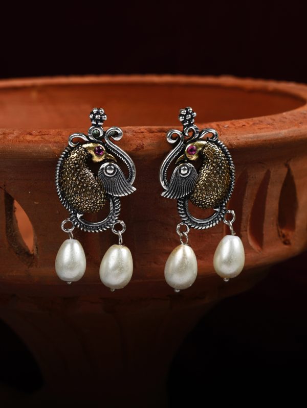 Made with a two tone plated styled up with peacock charm with pearls drop.