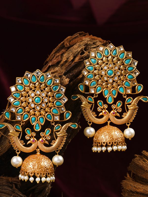 Vintage feel in this crafted peacock inspired earring embedded in mother-of-pearl, Turquoise and polki.