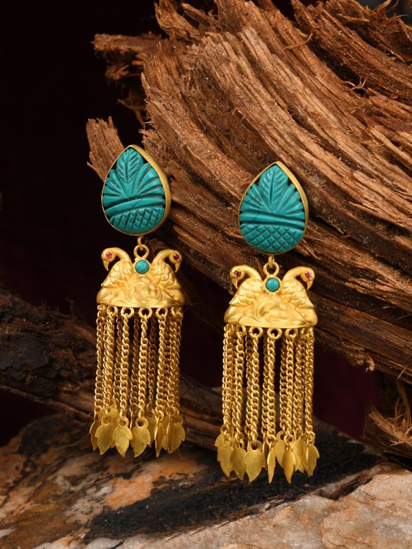 The fresh Turquoise carved stones owned and ultimately it stand out with peacock tassel look.