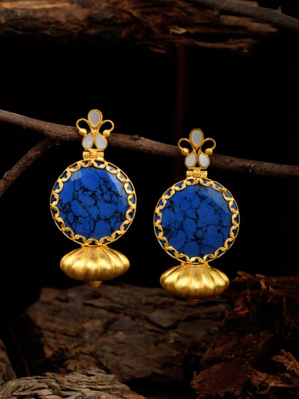 Earrings is teamed up with Synthetic Blue Colour Stone hanging with MOP.
