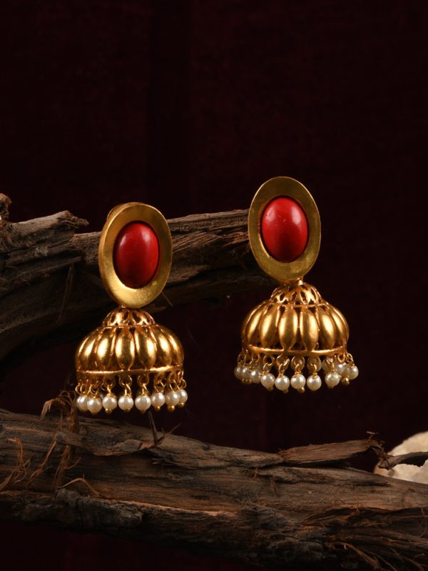Earrings is Jhumka theme Designed with CORAL stone & Textured adorned with pearls.