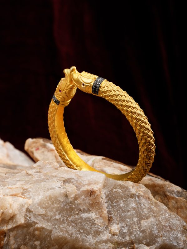Matte goldplated Indian kada with braided wire & Elephant look.