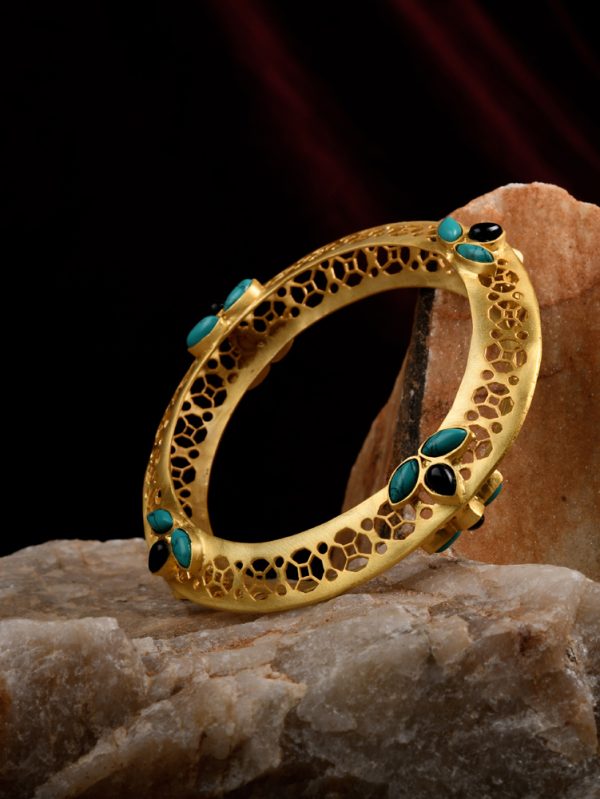Our bangle collection is a beautiful Fusion of colour stones & gold texture..created with utmost creation and Uniqueness.